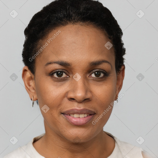 Joyful black young-adult female with short  black hair and brown eyes