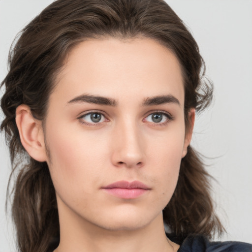 Neutral white young-adult female with medium  brown hair and brown eyes