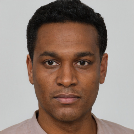 Neutral black young-adult male with short  black hair and brown eyes