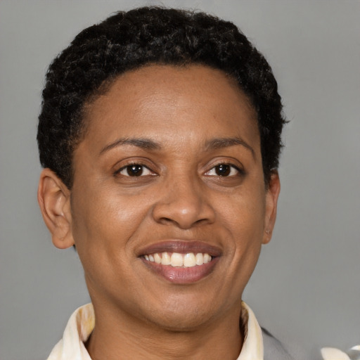 Joyful latino adult female with short  brown hair and brown eyes