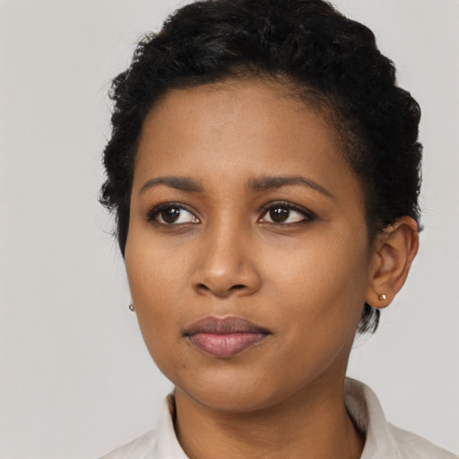 Neutral black young-adult female with short  black hair and brown eyes