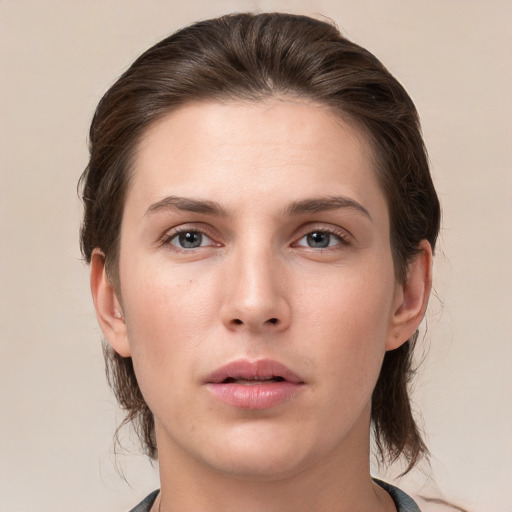 Neutral white young-adult female with medium  brown hair and brown eyes