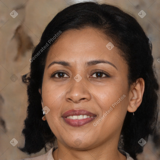 Joyful black adult female with medium  brown hair and brown eyes