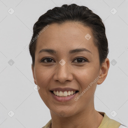 Joyful white young-adult female with short  brown hair and brown eyes