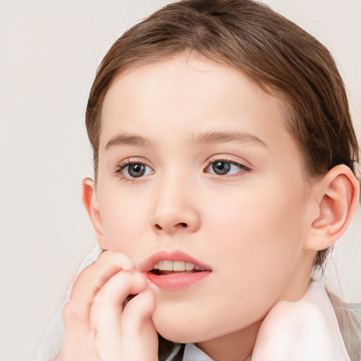 Neutral white child female with short  brown hair and blue eyes