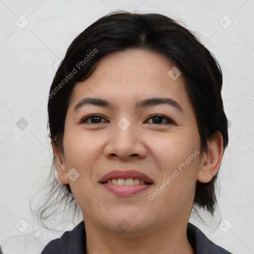 Joyful asian young-adult female with medium  black hair and brown eyes