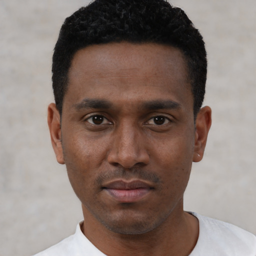 Neutral black young-adult male with short  black hair and brown eyes