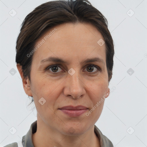 Joyful white adult female with short  brown hair and brown eyes