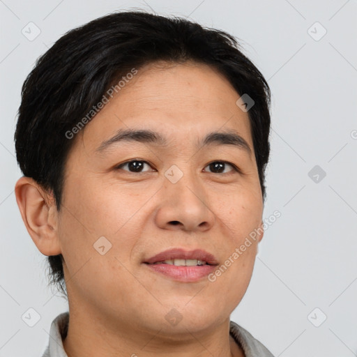 Joyful asian young-adult male with short  brown hair and brown eyes