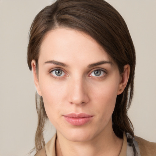 Neutral white young-adult female with medium  brown hair and grey eyes