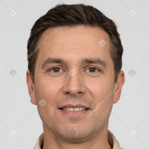 Joyful white adult male with short  brown hair and brown eyes