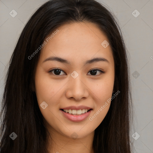 Joyful asian young-adult female with long  brown hair and brown eyes