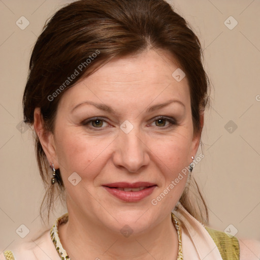 Joyful white adult female with medium  brown hair and blue eyes