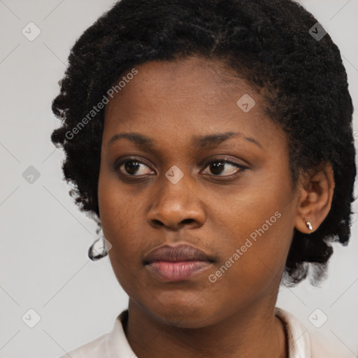 Neutral black young-adult female with short  brown hair and brown eyes