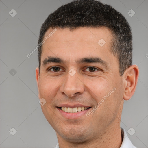 Joyful white young-adult male with short  brown hair and brown eyes