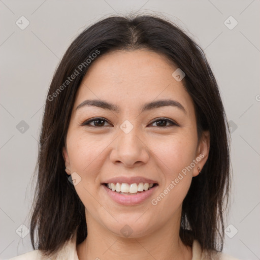 Joyful latino young-adult female with medium  brown hair and brown eyes