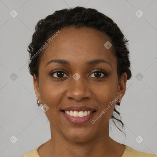 Joyful black young-adult female with short  brown hair and brown eyes