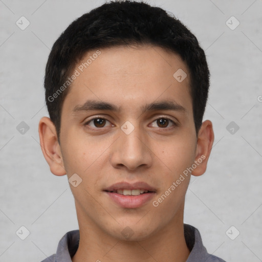 Joyful white young-adult male with short  black hair and brown eyes