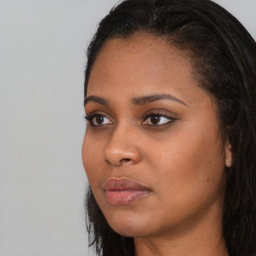 Neutral black young-adult female with long  black hair and brown eyes