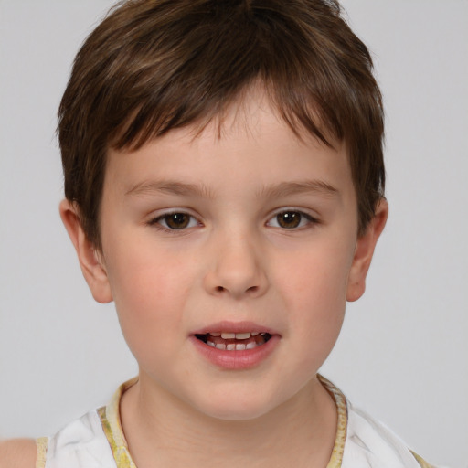 Joyful white child male with short  brown hair and brown eyes