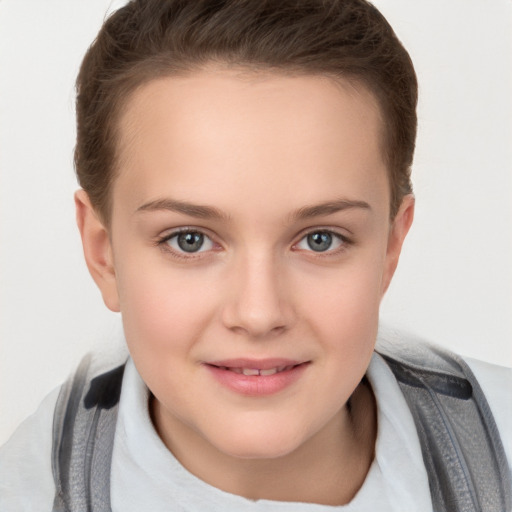 Joyful white child female with short  brown hair and grey eyes