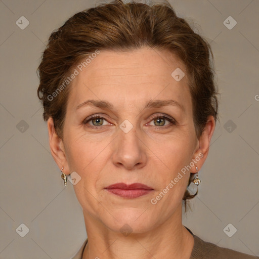 Joyful white adult female with short  brown hair and grey eyes