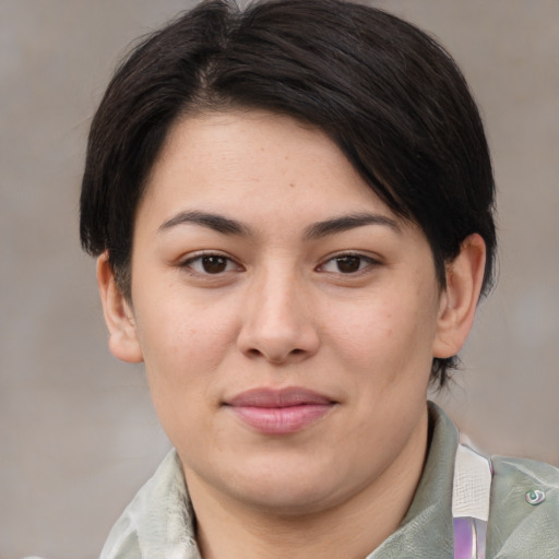Joyful asian young-adult female with medium  brown hair and brown eyes