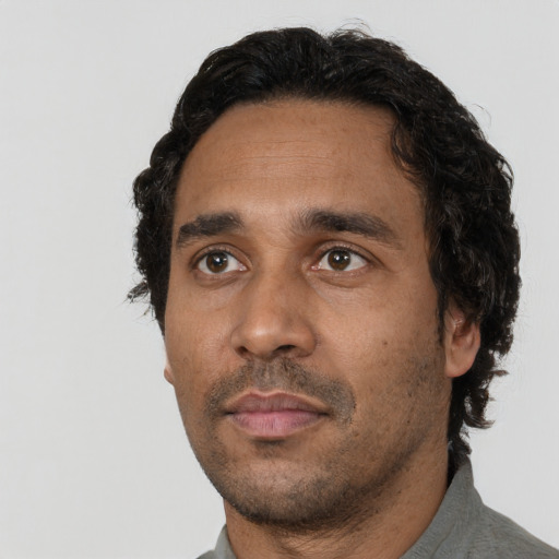 Neutral black adult male with short  black hair and brown eyes