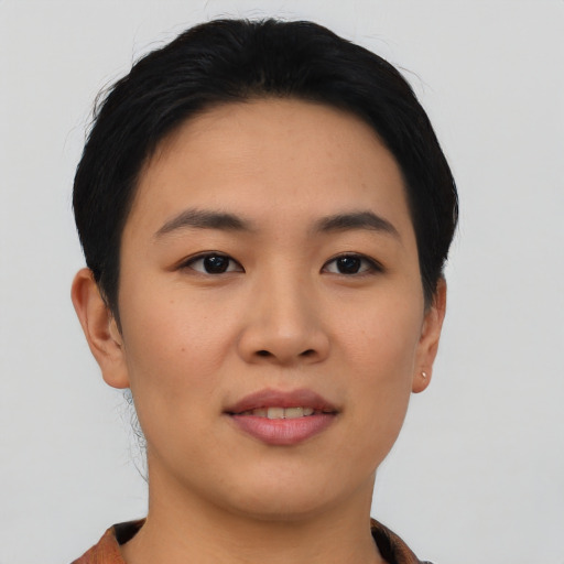 Joyful asian young-adult female with short  black hair and brown eyes