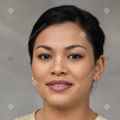 Joyful latino young-adult female with medium  brown hair and brown eyes