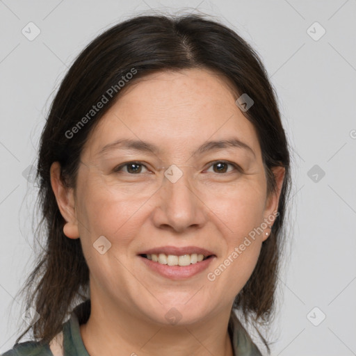 Joyful white adult female with medium  brown hair and grey eyes