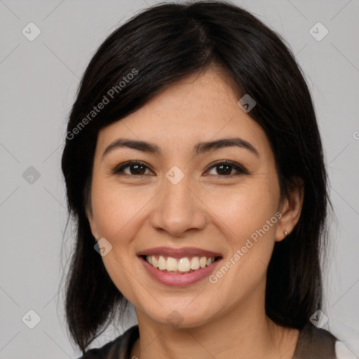 Joyful latino young-adult female with medium  brown hair and brown eyes