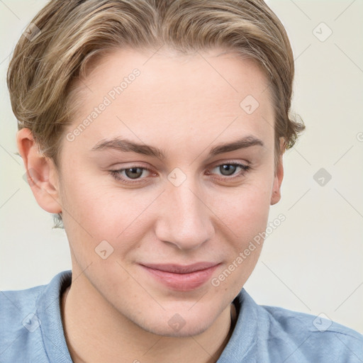 Joyful white young-adult female with short  brown hair and blue eyes