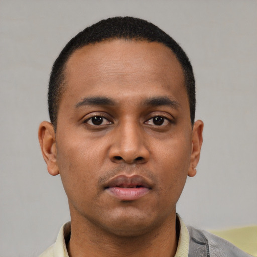 Neutral latino young-adult male with short  brown hair and brown eyes
