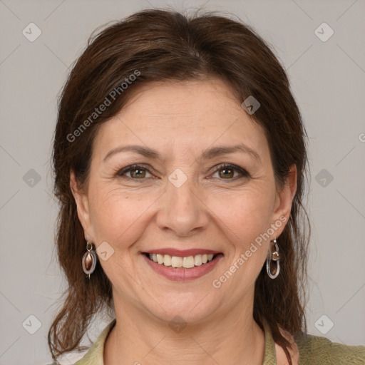 Joyful white adult female with medium  brown hair and grey eyes