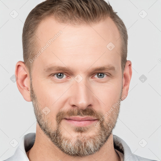 Joyful white adult male with short  brown hair and grey eyes