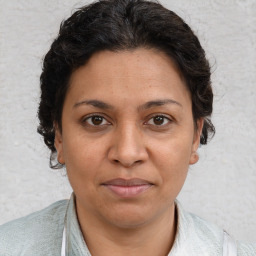 Joyful white adult female with short  brown hair and brown eyes