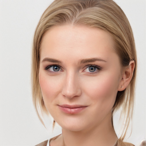 Joyful white young-adult female with medium  brown hair and blue eyes