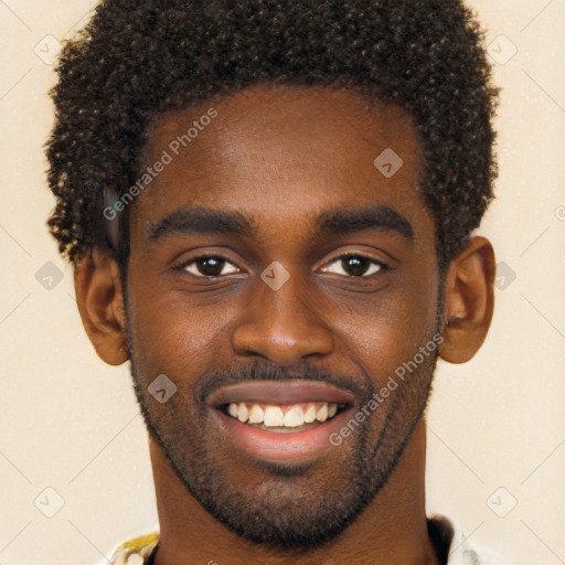 Joyful black young-adult male with short  brown hair and brown eyes