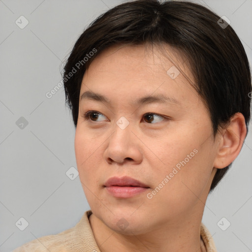 Joyful asian young-adult female with short  brown hair and brown eyes