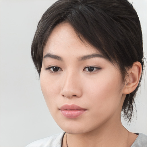 Neutral asian young-adult female with medium  brown hair and brown eyes