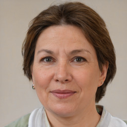 Joyful white adult female with medium  brown hair and brown eyes