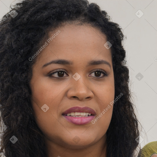 Joyful black young-adult female with long  brown hair and brown eyes