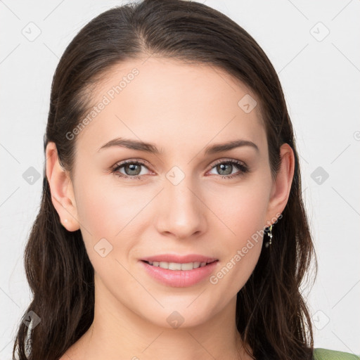 Joyful white young-adult female with long  brown hair and grey eyes