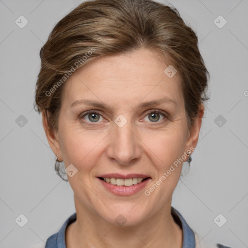 Joyful white adult female with short  brown hair and grey eyes