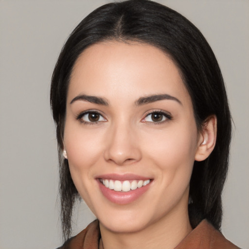 Joyful white young-adult female with medium  black hair and brown eyes