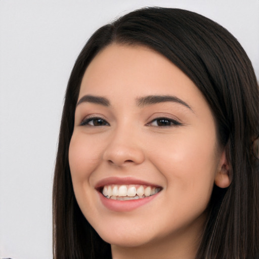 Joyful white young-adult female with long  black hair and brown eyes