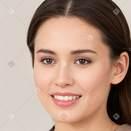 Joyful white young-adult female with long  brown hair and brown eyes