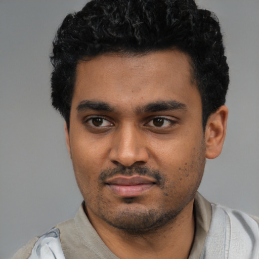 Neutral black young-adult male with short  black hair and brown eyes
