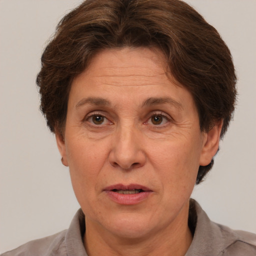 Joyful white middle-aged female with short  brown hair and brown eyes